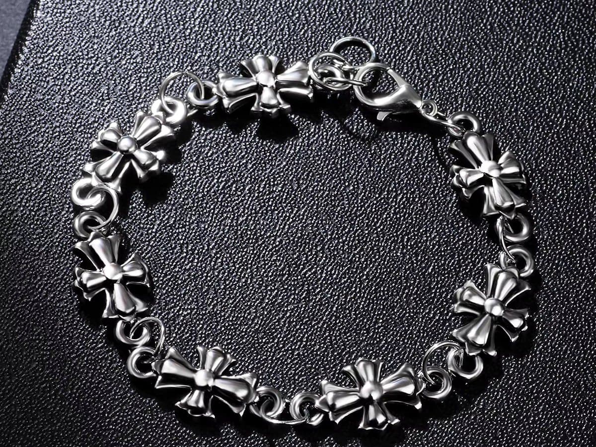 Silver cross-link bracelet on a black box