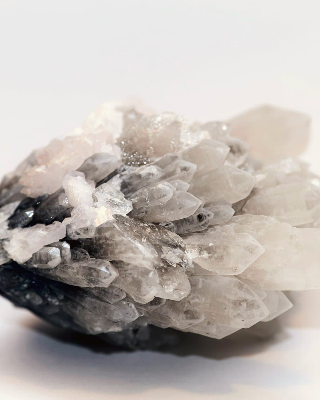 Clear quartz crystals in bright, airy light